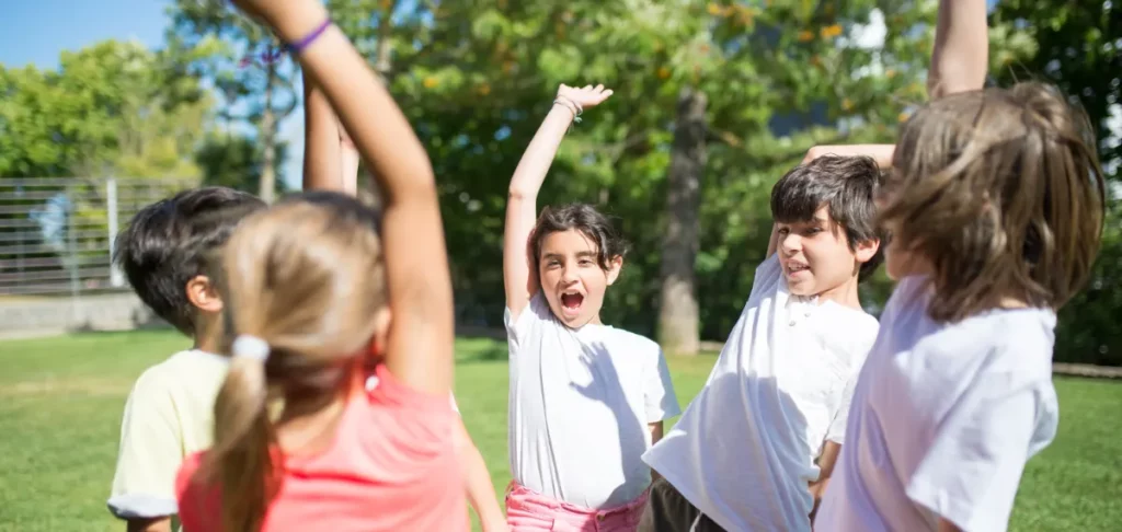A group of children playing on grass