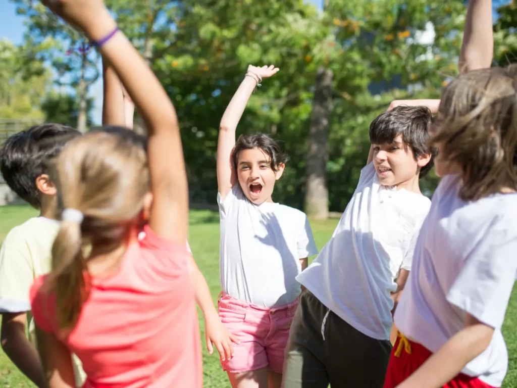 A group of children playing on grass