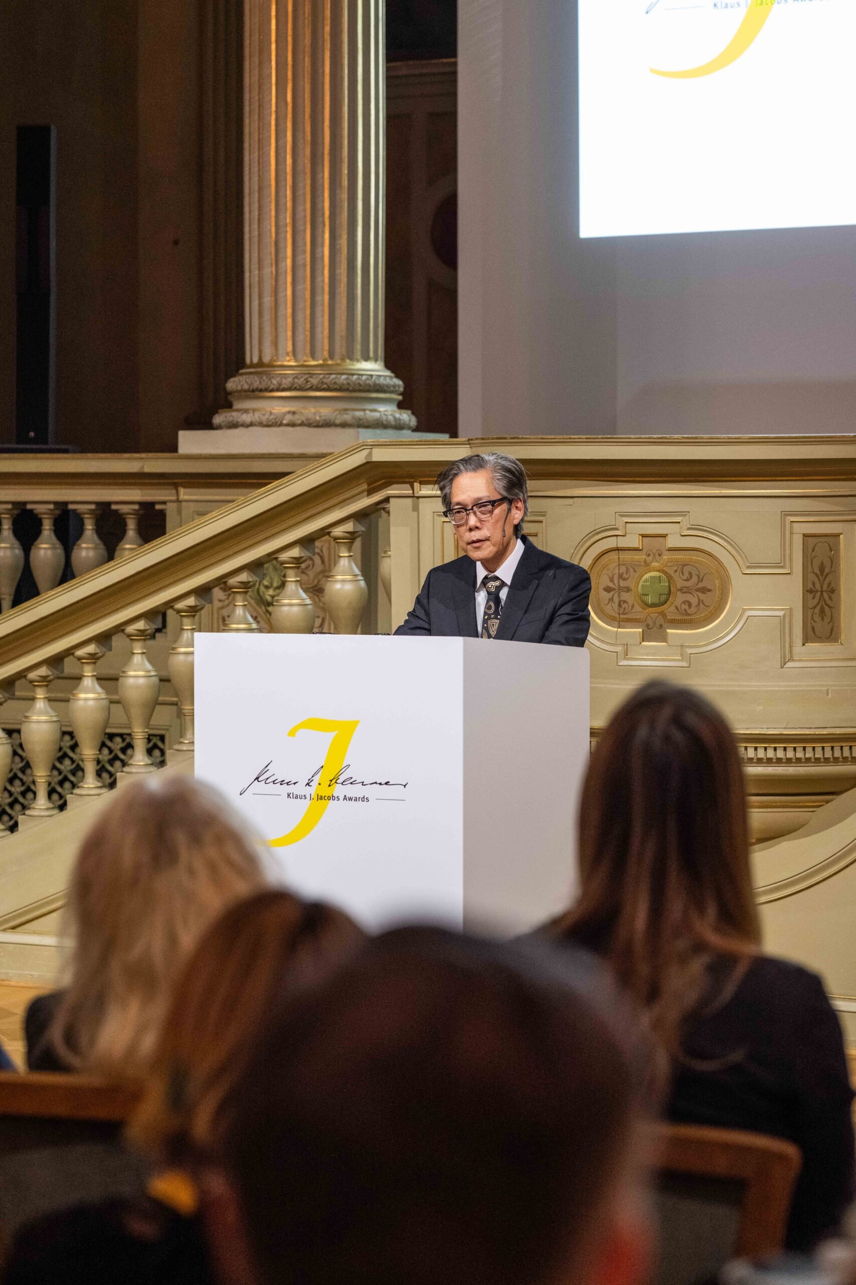 Professor Hirokazu Yoshikawa delivers his acceptance speech at the 2025 Klaus J. Jacobs Research Prize ceremony