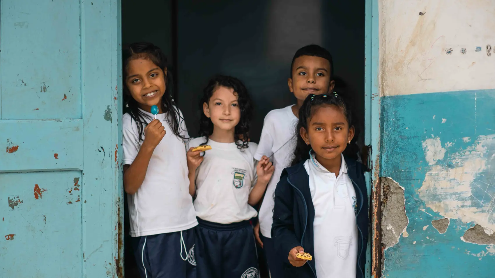 Schoolchildren standing in a doorway