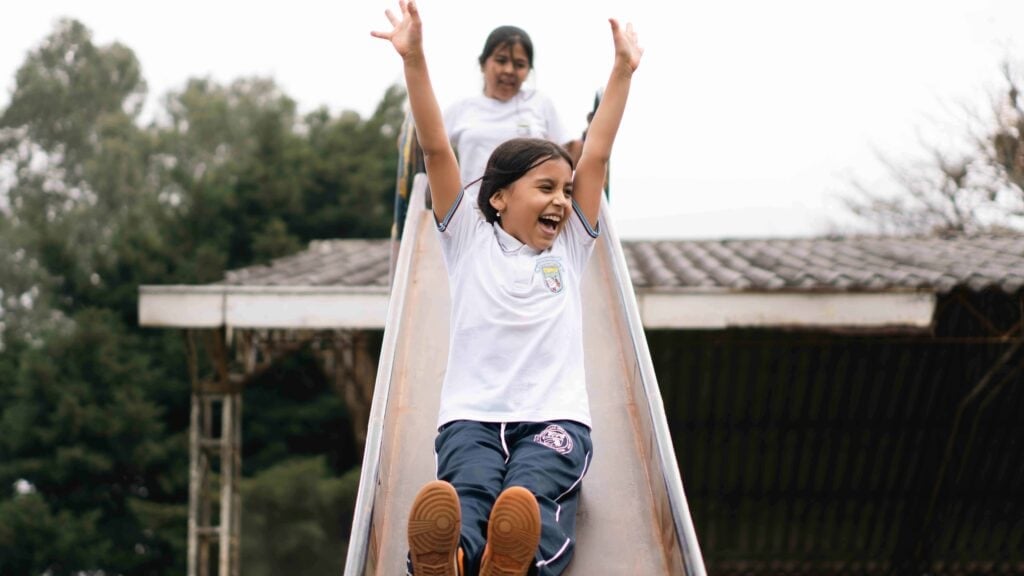 Girls playing on a slide